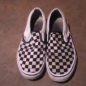 Black and white checkered slip-on Vans